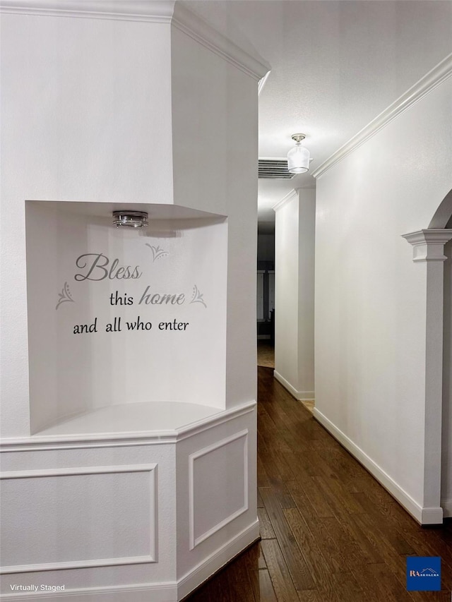 hall with crown molding, baseboards, and hardwood / wood-style floors