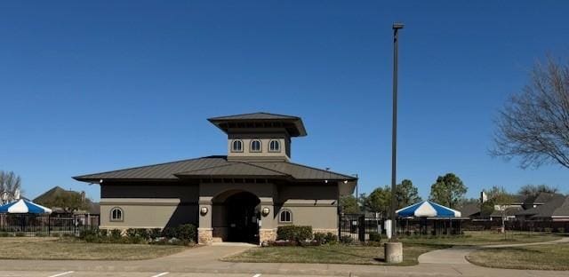 view of property with fence