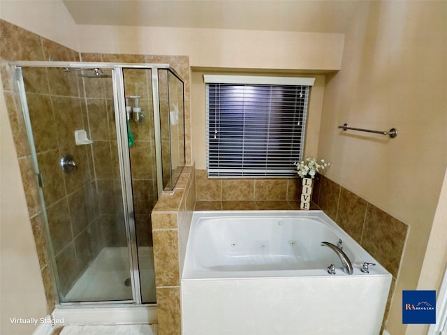 full bath featuring a shower stall and a whirlpool tub