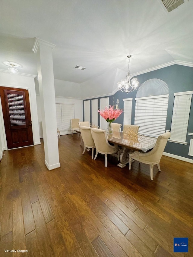 dining space with lofted ceiling, visible vents, wood-type flooring, and ornamental molding