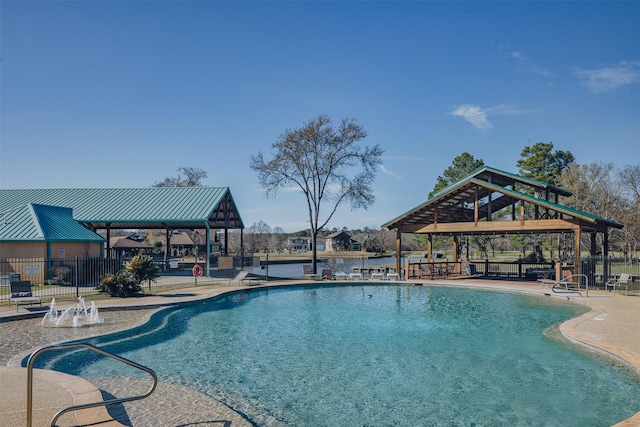 community pool featuring a patio area, fence, and a gazebo