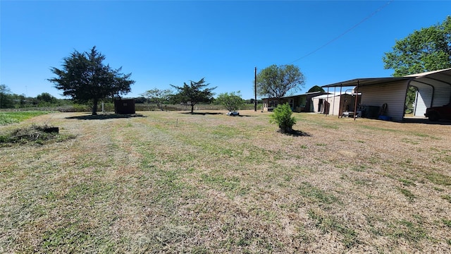 view of yard with a carport