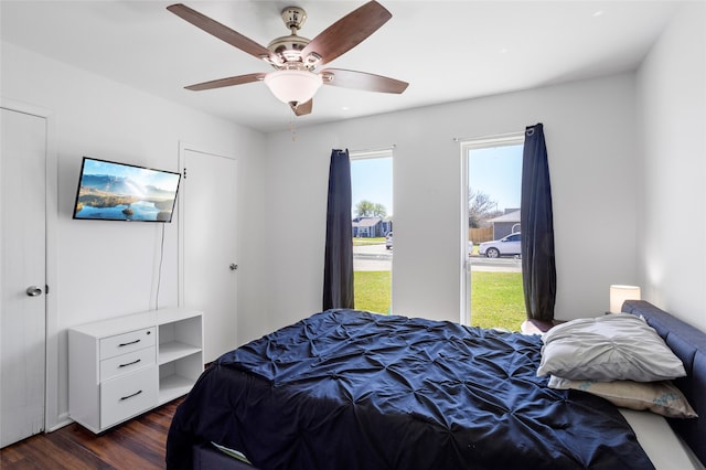 bedroom featuring dark wood-style floors and ceiling fan