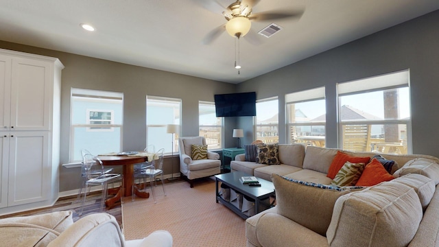 living area with recessed lighting, visible vents, a ceiling fan, wood finished floors, and baseboards