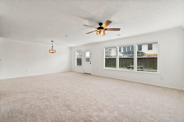 unfurnished living room featuring ceiling fan, a textured ceiling, light carpet, visible vents, and baseboards