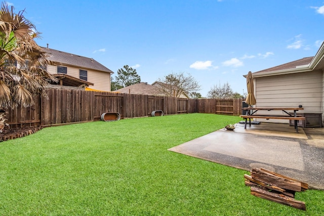 view of yard featuring a patio area and a fenced backyard