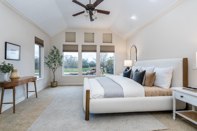 carpeted bedroom with crown molding, vaulted ceiling, baseboards, and a ceiling fan