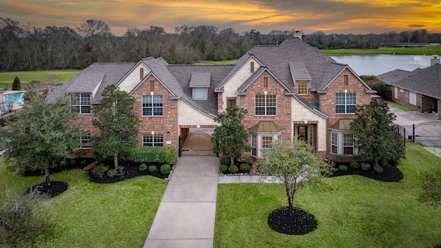 20803 Fairhaven Crossing Dr, Cypress, TX 77433 - traditional home featuring concrete driveway, a garage, brick siding, and a yard