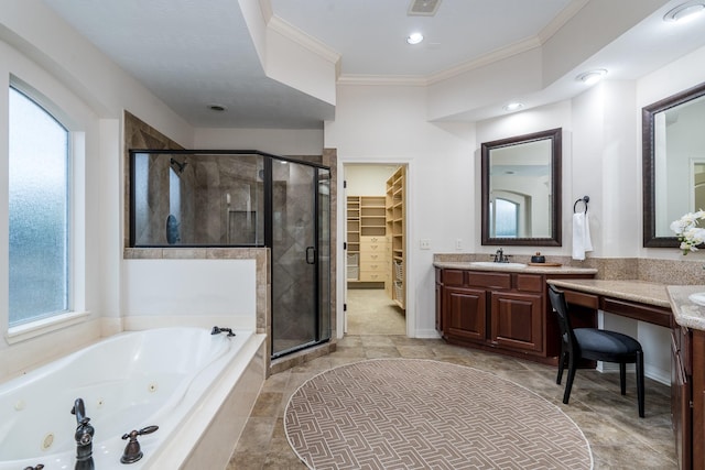 full bathroom featuring ornamental molding, a tub with jets, a spacious closet, vanity, and a shower stall