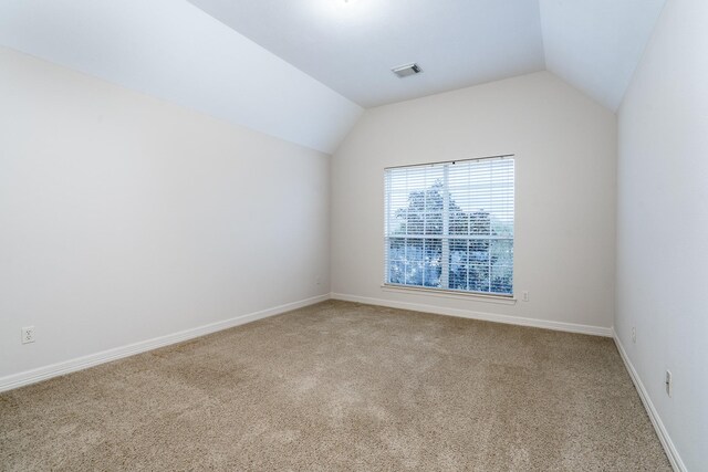 20803 Fairhaven Crossing Dr, Cypress, TX 77433 - empty room with lofted ceiling, carpet, and baseboards