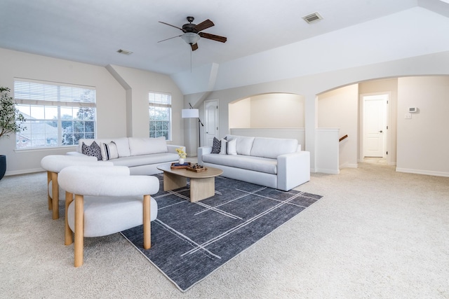 living area with carpet, a healthy amount of sunlight, and visible vents