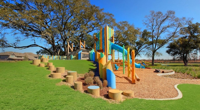 community jungle gym featuring a lawn