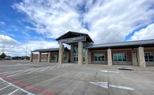 view of property with uncovered parking