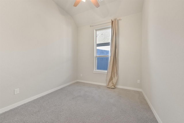 unfurnished room featuring lofted ceiling, ceiling fan, carpet floors, and baseboards