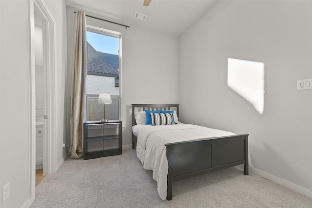 carpeted bedroom with a ceiling fan, visible vents, and baseboards