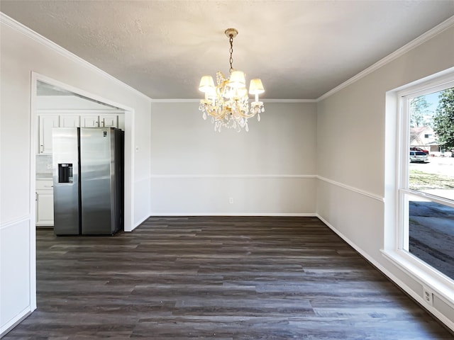 unfurnished dining area featuring an inviting chandelier, baseboards, ornamental molding, and dark wood-type flooring