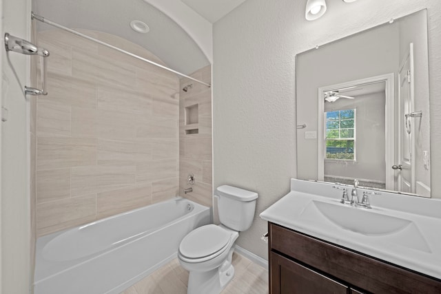 bathroom with a textured wall, toilet, tub / shower combination, vanity, and wood finished floors