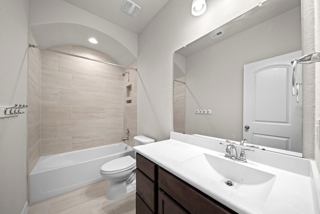 bathroom with toilet, bathing tub / shower combination, visible vents, and vanity