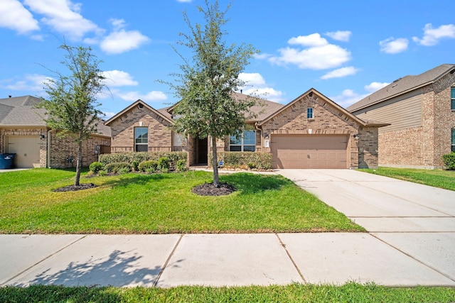 view of front of house with a garage, driveway, brick siding, and a front lawn