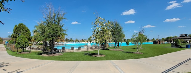 view of home's community featuring a lawn