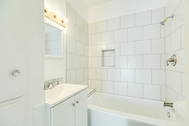 bathroom featuring tub / shower combination and vanity