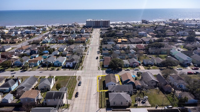 drone / aerial view featuring a residential view and a water view