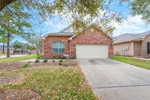 view of front of house featuring an attached garage, brick siding, and driveway