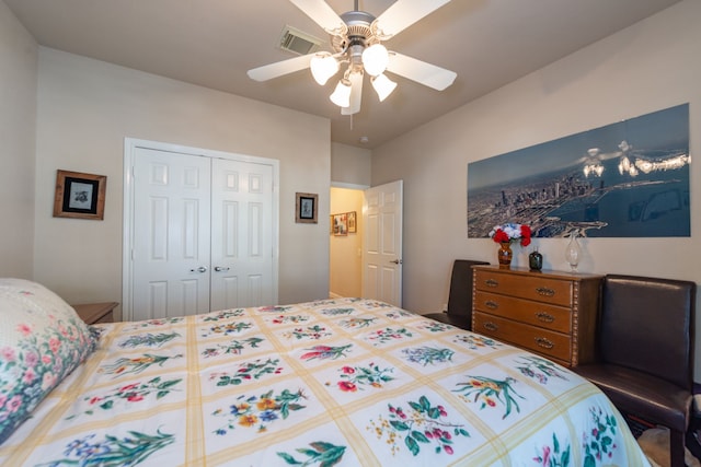 bedroom with visible vents, a closet, and ceiling fan