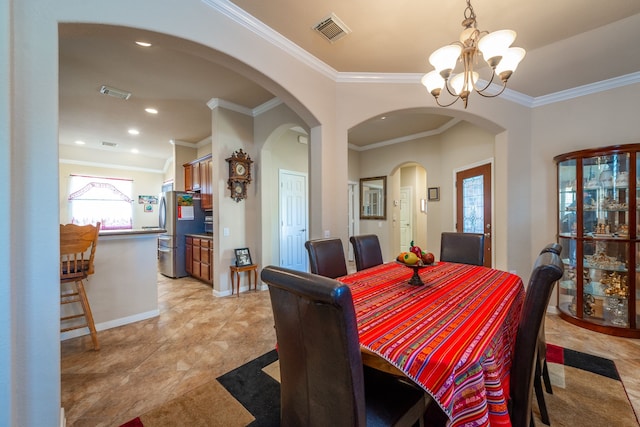 dining area with a notable chandelier, arched walkways, visible vents, and ornamental molding