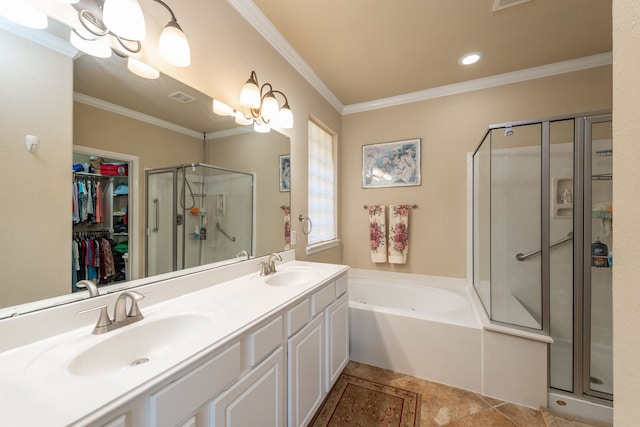 bathroom featuring a sink, visible vents, a stall shower, and crown molding