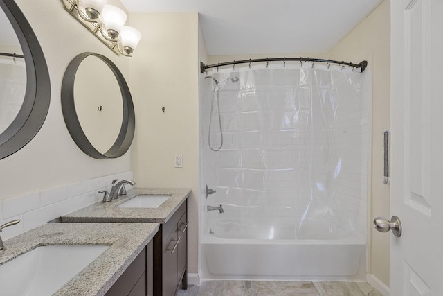 full bathroom featuring shower / bath combo and vanity