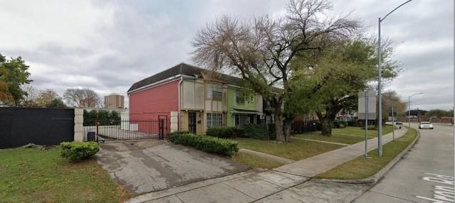 exterior space with a gate and a yard