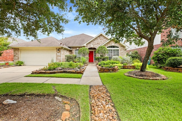 view of front of house with an attached garage, brick siding, concrete driveway, and a front yard