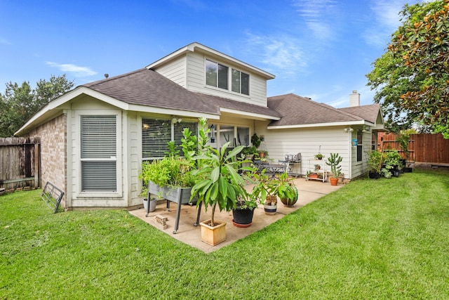 back of house featuring a patio, a yard, and fence