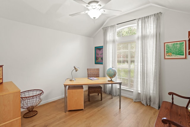 office area with vaulted ceiling, light wood-style flooring, baseboards, and ceiling fan