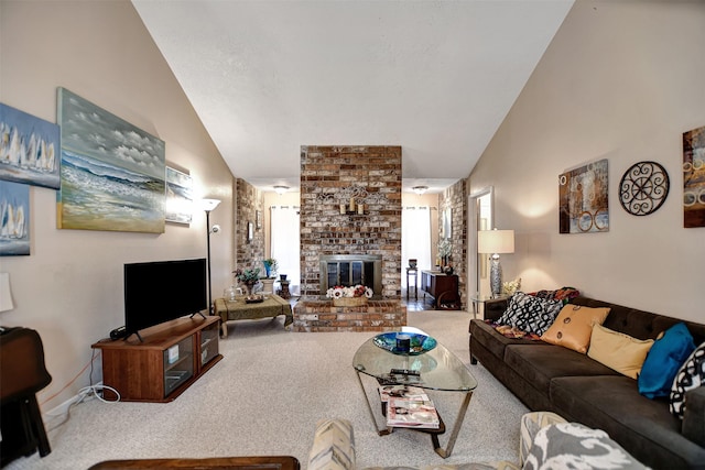 carpeted living area with a fireplace and high vaulted ceiling