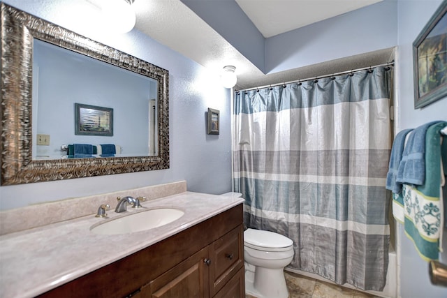 full bathroom featuring vanity and toilet