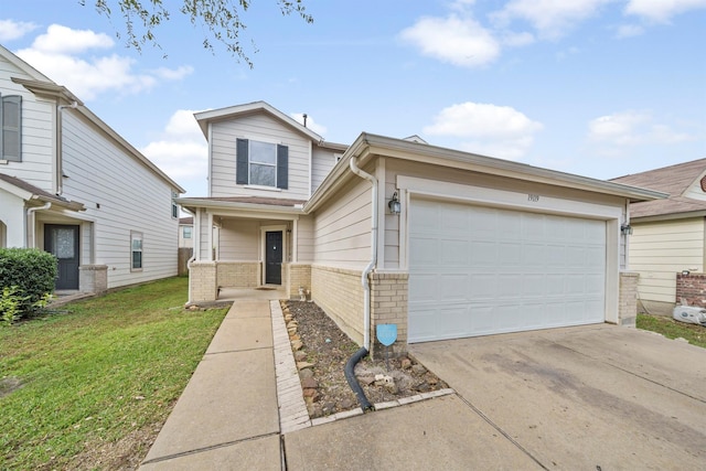 view of front of property featuring a garage, driveway, brick siding, and a front yard