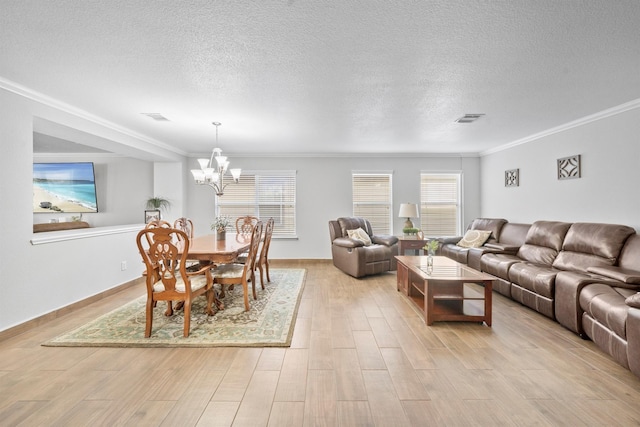 living area with ornamental molding, visible vents, and light wood-style floors