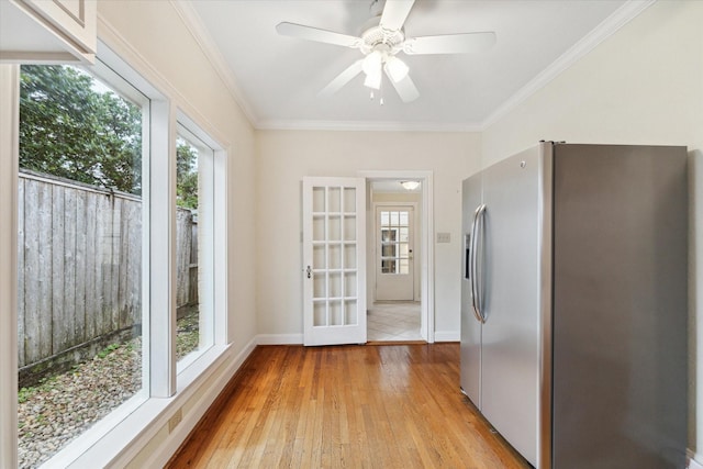 interior space with ceiling fan