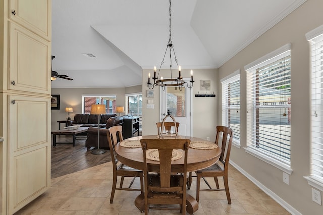 dining area with baseboards, visible vents, an inviting chandelier, lofted ceiling, and ornamental molding