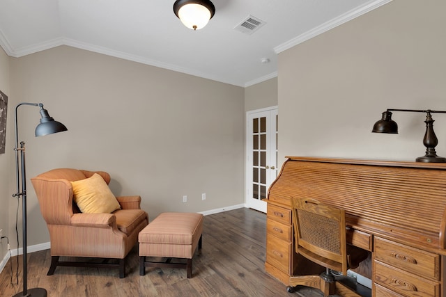 office featuring visible vents, ornamental molding, baseboards, and wood finished floors