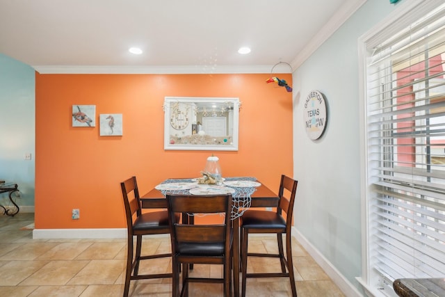 tiled dining space featuring ornamental molding, recessed lighting, and baseboards