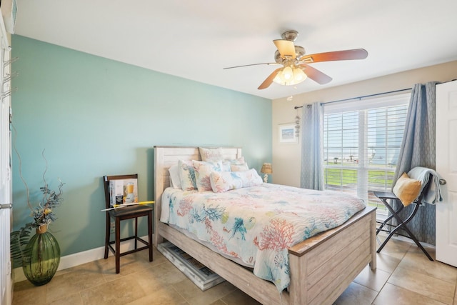 bedroom featuring ceiling fan, tile patterned flooring, and baseboards