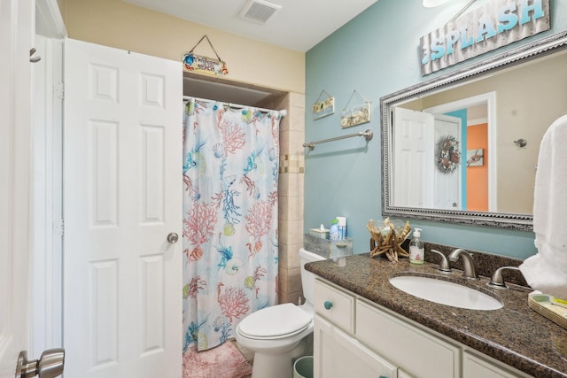 bathroom featuring toilet, visible vents, a shower with shower curtain, and vanity