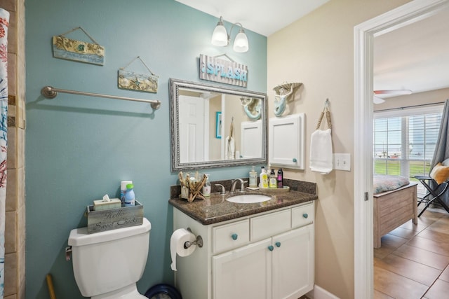 full bath with toilet, tile patterned flooring, and vanity