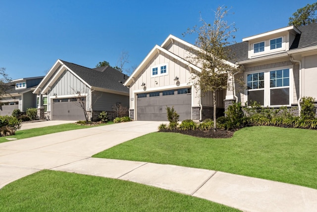 view of front of house featuring board and batten siding, a garage, stone siding, driveway, and a front lawn