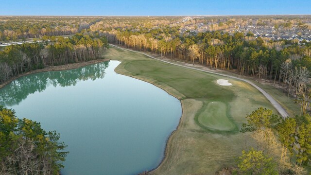 aerial view featuring a water view, a view of trees, and golf course view