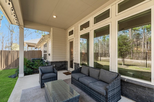 view of patio / terrace featuring a fenced backyard and an outdoor living space