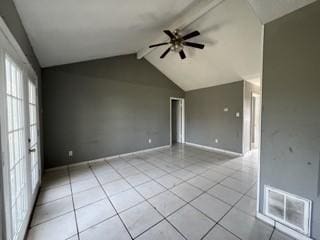 unfurnished room featuring vaulted ceiling with beams, light tile patterned floors, visible vents, ceiling fan, and baseboards